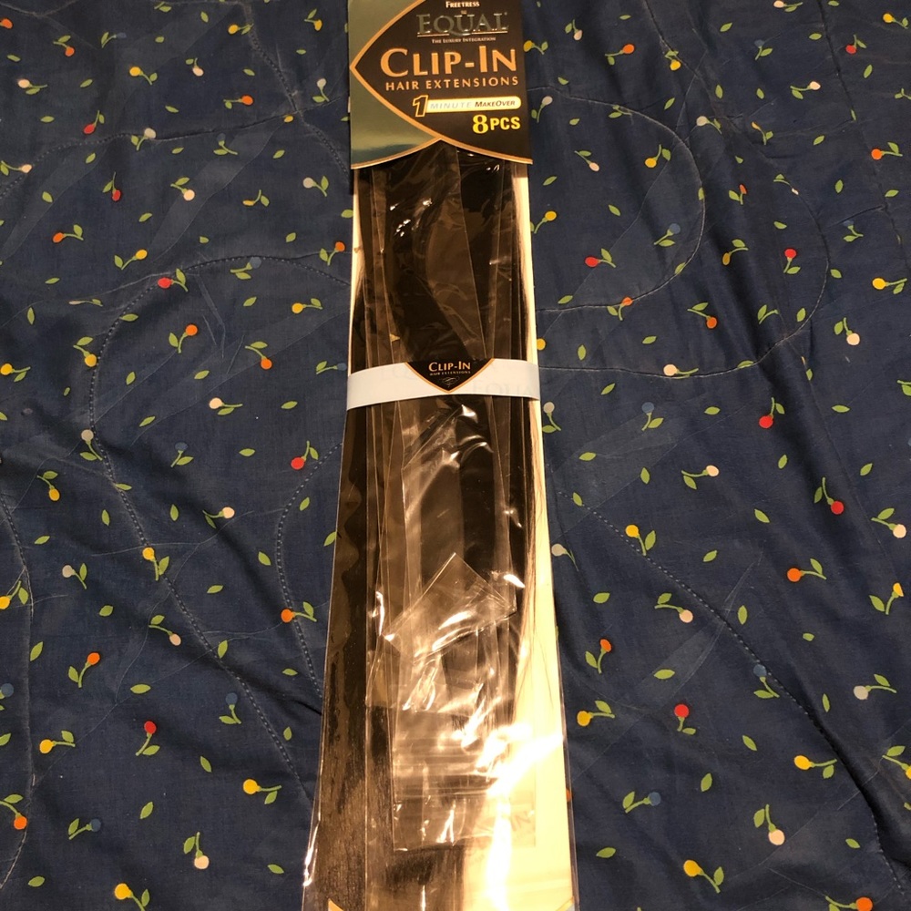 Black false hair clip in extensions